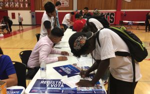 Students register to vote at Central High School in Phoenix, Arizona, on Sept. 27, 2016. (Photo by Mindy Riesenberg/Cronkite News)
