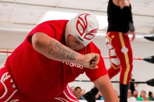 El Gordo recovers during a match at a P.o.r. Promotions show in Phoenix. (Photo by Christopher West/Cronkite News)