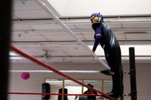 Shadow Fox looks out toward the crowd before a match during a P.o.r. Promotions show in Phoenix. Luchadores traditionally wear masks that become an integral part of their characters. (Photo by Christopher West/Cronkite News)