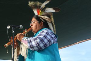 Palmer Lomakema plays a harmonious, Native American song on the wind flute at the Arizona State Fair. (Photo by Kristiana Faddoul/Cronkite News)