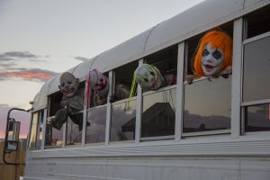 Clowns on a bus in the haunted corn fields at Fear Farm. (Photo by Ally Carr/Cronkite News)