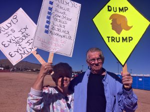 Annette and Rich Tomshack protest Republican presidential candidate Donald Trump at a rally in Prescott Valley. (Photo by Bri Cossavella/Cronkite News)