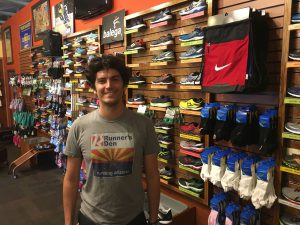 Nate Wallack from Runner's Den values a shoe that is light weight and flexible, but says everyone is chasing comfort. (Photo by Russ Oviatt/Cronkite News)