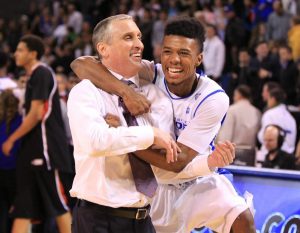 Point guard Shannon Evans embraces coach Bobby Hurley during a game at the Univeristy at Buffalo. (Photo courtesy of Leslie Hurley)