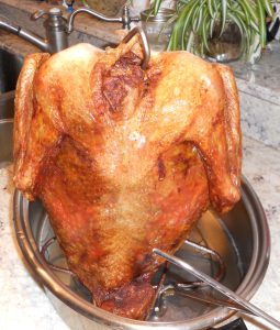 Follow the proper safety procedures before dropping your turkey into hot cooking oil. Measure the oil so it won’t overflow once the turkey is placed into the boiling liquids. (Photo courtesy of Jameson Fink/flickr)