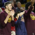 Arizona State’s Vitaliy Shibel, left, celebrates on the bench with Bobby Hurley Jr., center, and Romello White, right. ASU defeated Washington, 86-75, Wednesday at Wells Fargo Arena in Tempe.(Photo by Fabian Ardaya/Cronkite News)