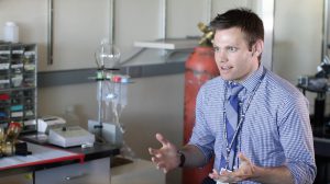 Alexander Sandweiss has spent the past five years studying how opioid drugs interact with the human body. He explains the process in the Vanderah lab at the University of Arizona’s Department of Pharmacology. (Photo by Cassie Ronda/Cronkite News)