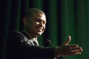 Phoenix Suns head coach Earl Watson talks to an audience about his childhood and upbringing during the Bridge Forum in Scottsdale on Monday. (Photo by Josh Orcutt/Cronkite News)