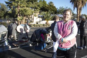 Betty Jean-Rider poses for a portrait in front of her possessions after completing the Point-in-Time homeless count survey on Jan. 24, 2017. (Photo by Tynin Fries/Cronkite News)