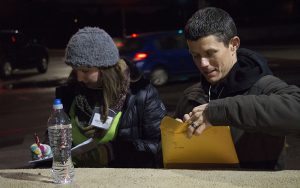 Community Bridges volunteers Julie Wonsowicz-Moore (left) and TJ Howard complete surveys during the Point-in-Time homeless count on Tuesday. (Photo by Tynin Fries/Cronkite News)