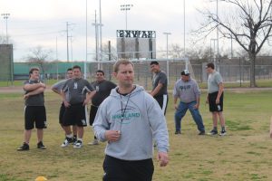 New football coach Brock Farrel gets to work at Highland High School. (Photo by Zach Alvira/Cronkite News)