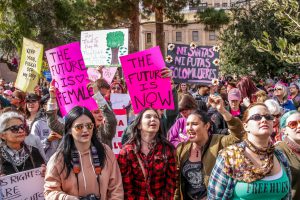 Protestors raise signs in hopes that their voices are heard at the Phoenix march conducted in solidarity with the Women’s March on Washington. (Photo by Saeed Alshamisi/Cronkite News)