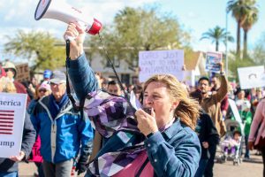 A marcher shouted in support of women’s issues at a Phoenix march in solidarity with the Women’s March on Washington. People marched in several Arizona cities and towns. (Photo by Saeed Alshamisi/Cronkite News)