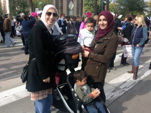 Best friends Rawa Awad, 29, and Nadia El-Hillal, 29, attended the march with El-Hillal’s sons to “make sure that we’re a part of history.” (Photo by Saundra Wilson/Cronkite News)