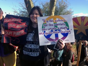 Phoenix College student Jennie Clements, 20, rode the light rail and a city bus to attend the Phoenix march. (Photo by Saundra Wilson/Cronkite News)