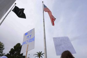 Several signs protesting the inauguration of President Donald Trump were present on Friday, Jan. 20, 2017 at the Arizona State Capitol. Signs read “NOT MY PRESIDENT” and “THERE IS TOO MUCH WRONG & UNJUST WITH TRUMP TO FIT ON THIS SIGN.” (Photo by Ryan Santistevan/Cronkite News)