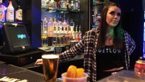 Nicollette Davis, a bartender at Low Key Piano Bar in Tempe, talks about the importance of the “Angel Shot.” (Photo by Erica Apodaca/Cronkite News)