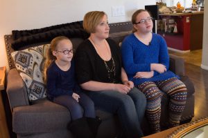 Cora Childress (left), Jennifer Childress (middle) and Caitlin Childress (right) all use Buzzies to help with anxiety. (Photo by Megan Bridgeman/Cronkite News)