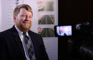 Robert Hazlett, senior engineering project manager for Maricopa Association of Governments, talks about improvements to the  Interstate 10 and Interstate 17 spine corridor. (Photo by Jessica Clark/Cronkite News)