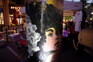 The door that represents the future in The Doorways installation has a graffiti-style background and a silhouette of a Black woman with an Afro. Photo taken at the Juneteenth Block Party on June 15 in Tempe. (Photo by Stella Subasic/Cronkite News)