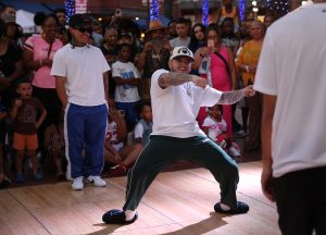 Adrian Espinoza, also known as Accuracy, participates in a freestyle break dance battle hosted by the Furious Styles Crew at the Juneteenth Block Party in Tempe, on June 15. (Photo by Stella Subasic/Cronkite News)