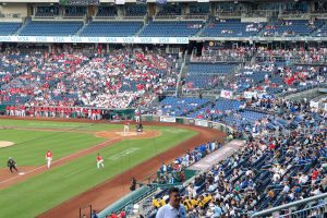 Attendees on both the Republican and Democratic side of Nationals Park wear colors representing their respective members of Congress in Washington, D.C., on June 12, 2024. (Photo by Morgan Kubasko/Cronkite News)