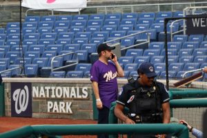 Rep. Ruben Gallego takes a phone call before the Congressional Baseball Game at Nationals Park in Washington, D.C., on June 12, 2024. (Photo by Morgan Kubasko/Cronkite News)